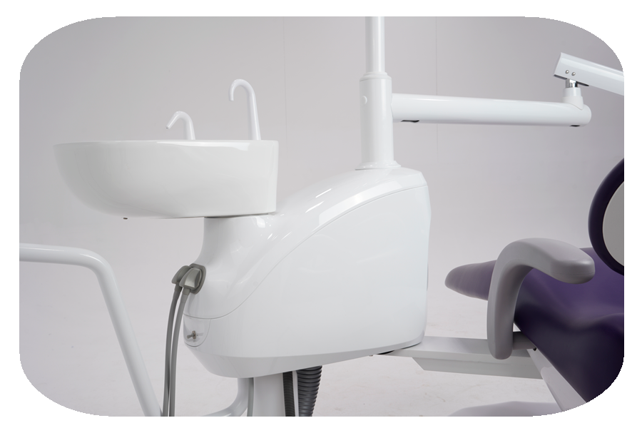 New dental chair with sink and lamp in a clinical setting