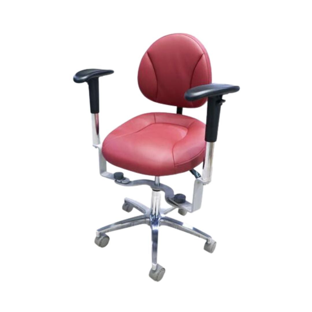 Red dental chair with armrests on a white background