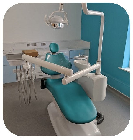 Dental chair in a clinical setting with blue and white colors